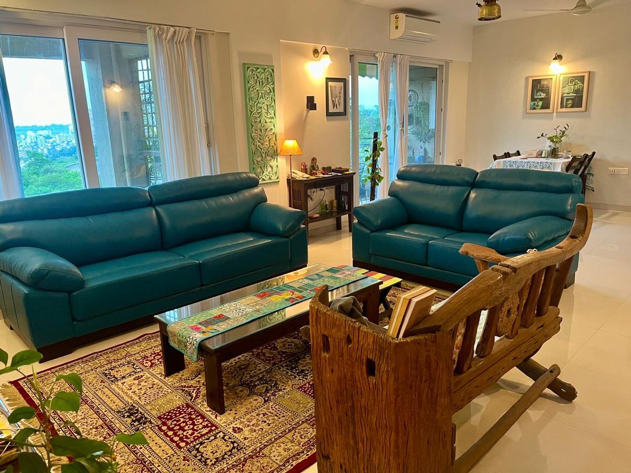 Teal sofa set in a finished living room