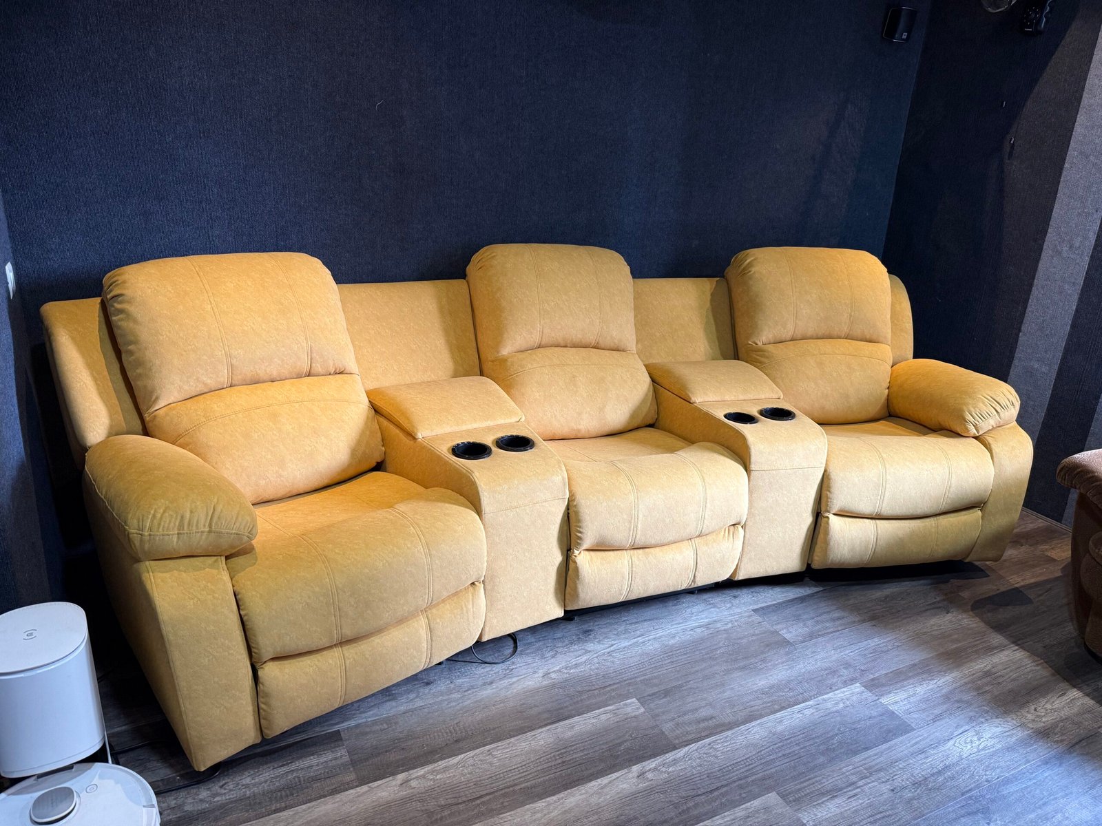 Three-seat motion seating in tan upholstery